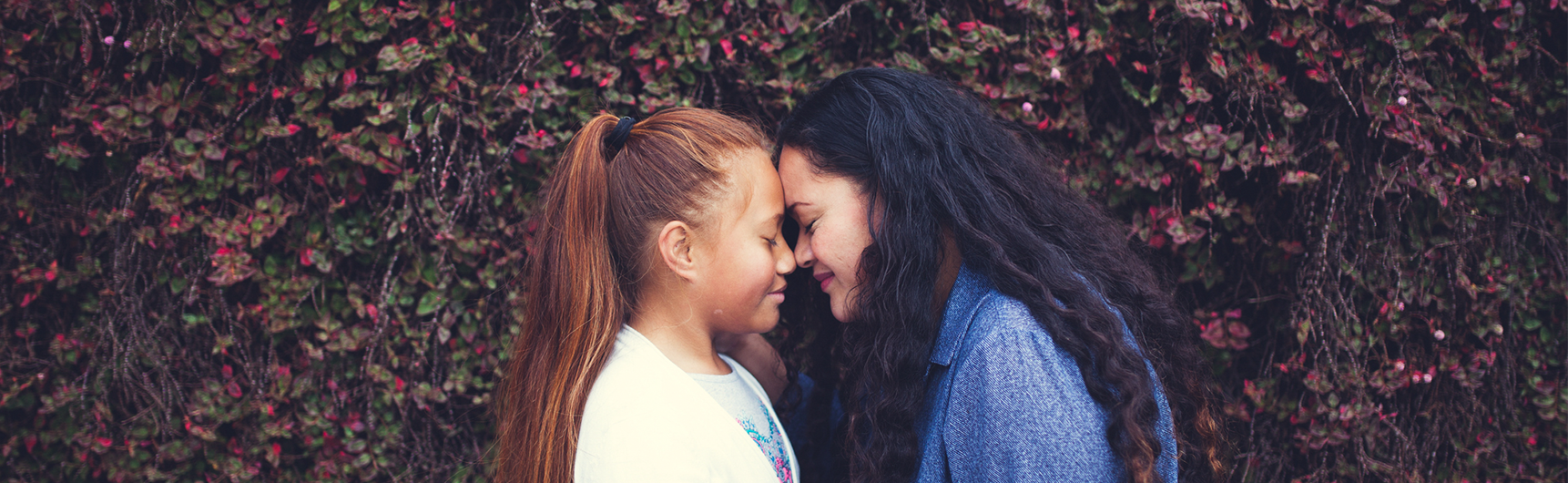 Two females sharing a Hongi