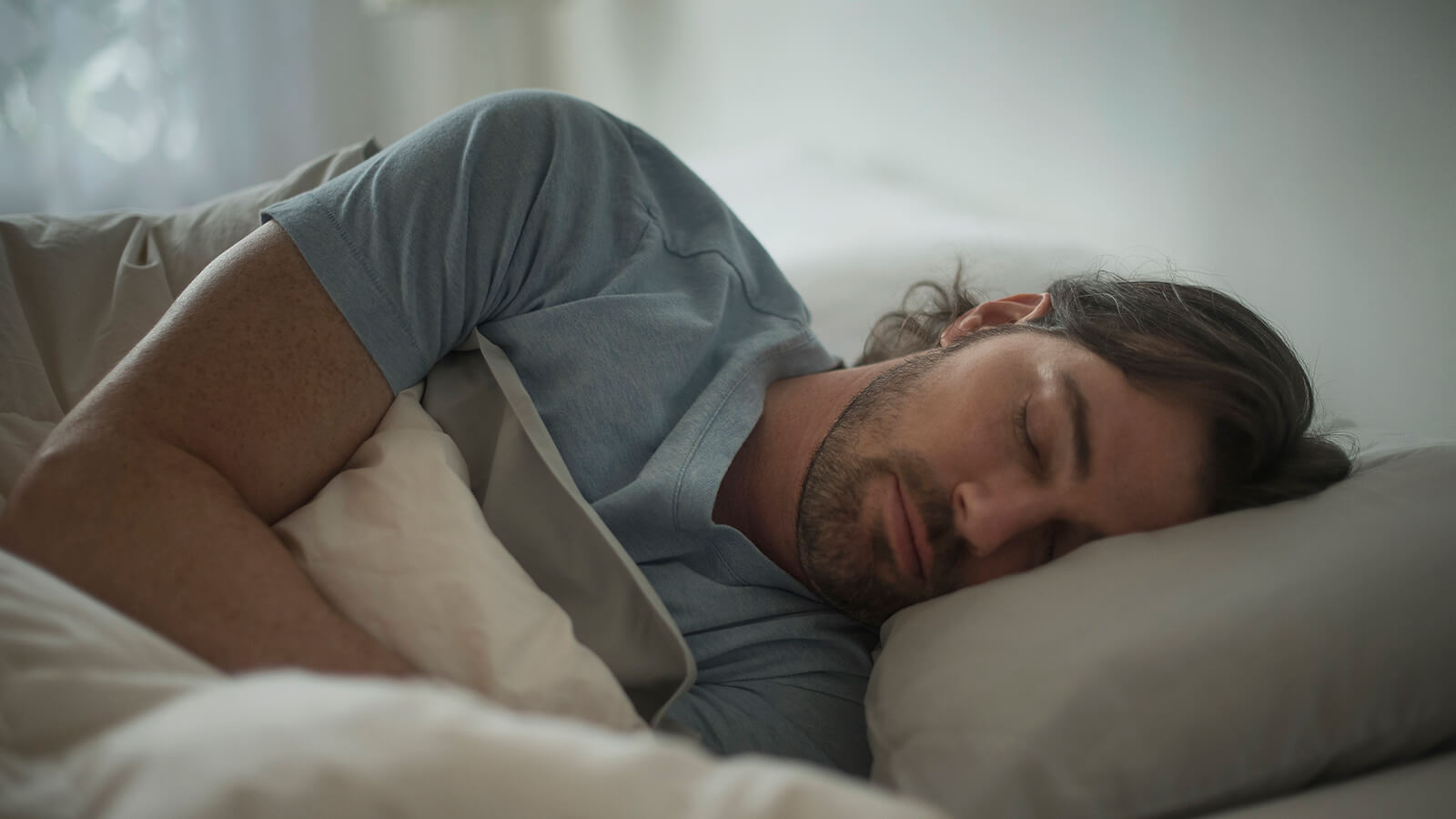 Southern Cross - A man sleeps in bed A man sleeps in bed